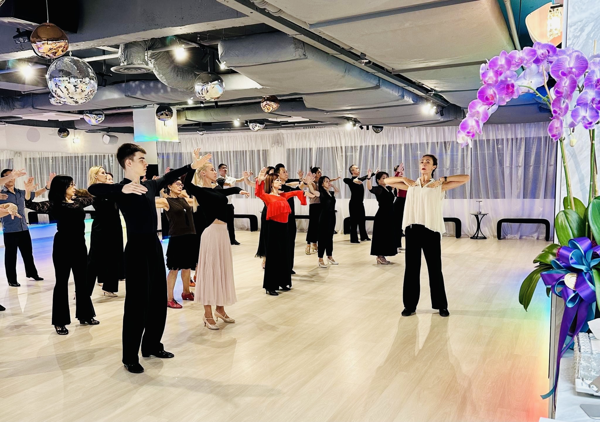 Latin dance group class with adult students at Galaxy Dance Academy