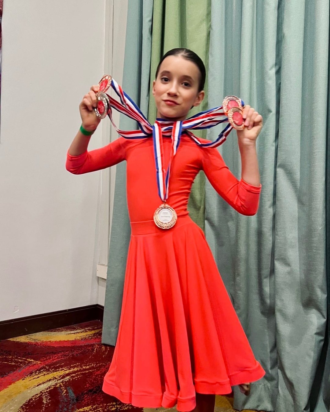 Lisa with multiple medals at the 2025 National Championship
