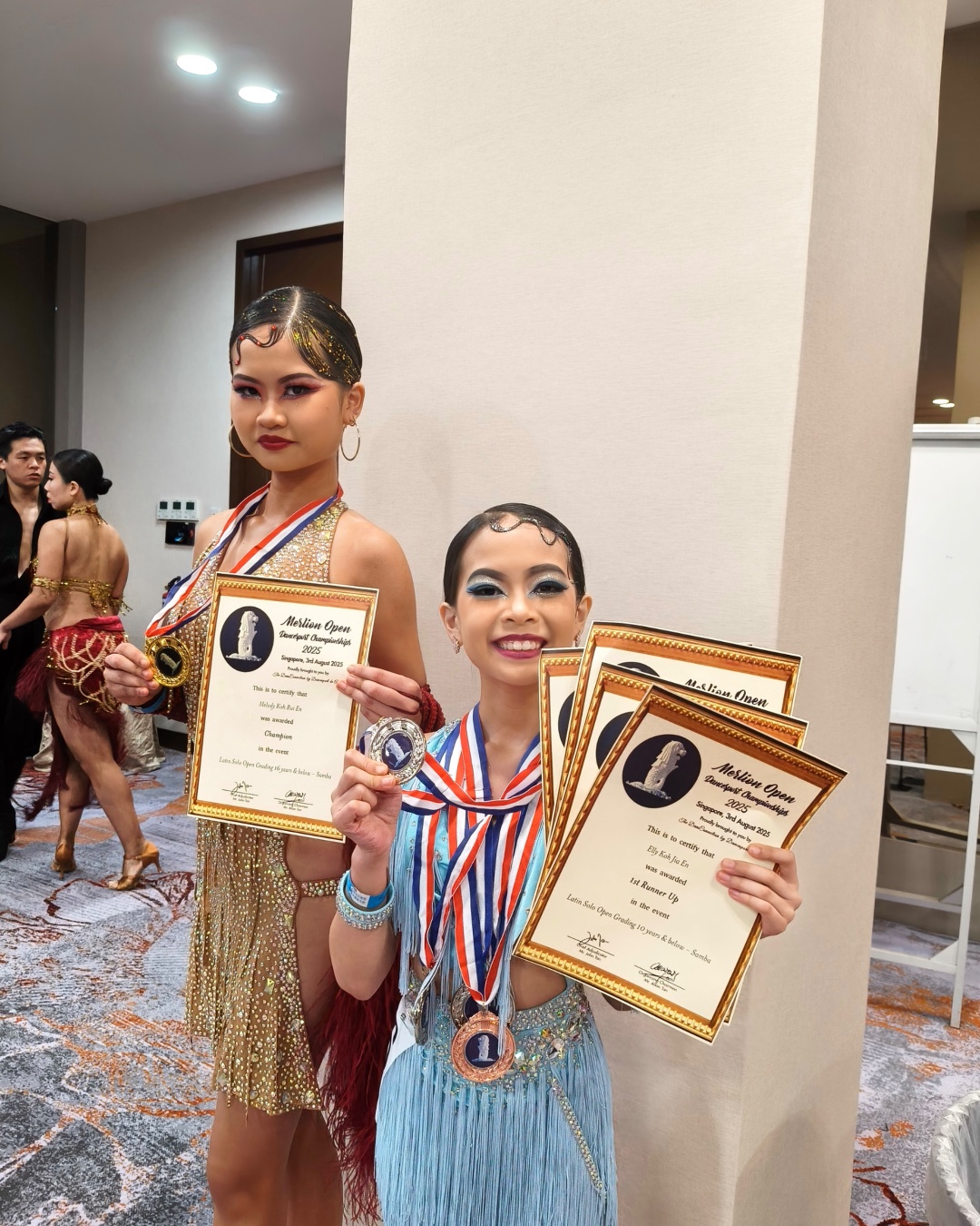 Sisters Melody and Elly with medals and certificates at Merlion Open 2025
